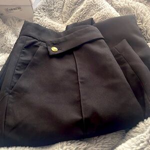 Black straight work pants with cute little belts never worn